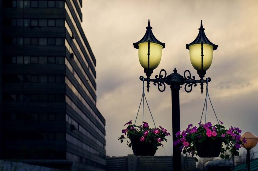 Wonderful old street lights with flower pots
